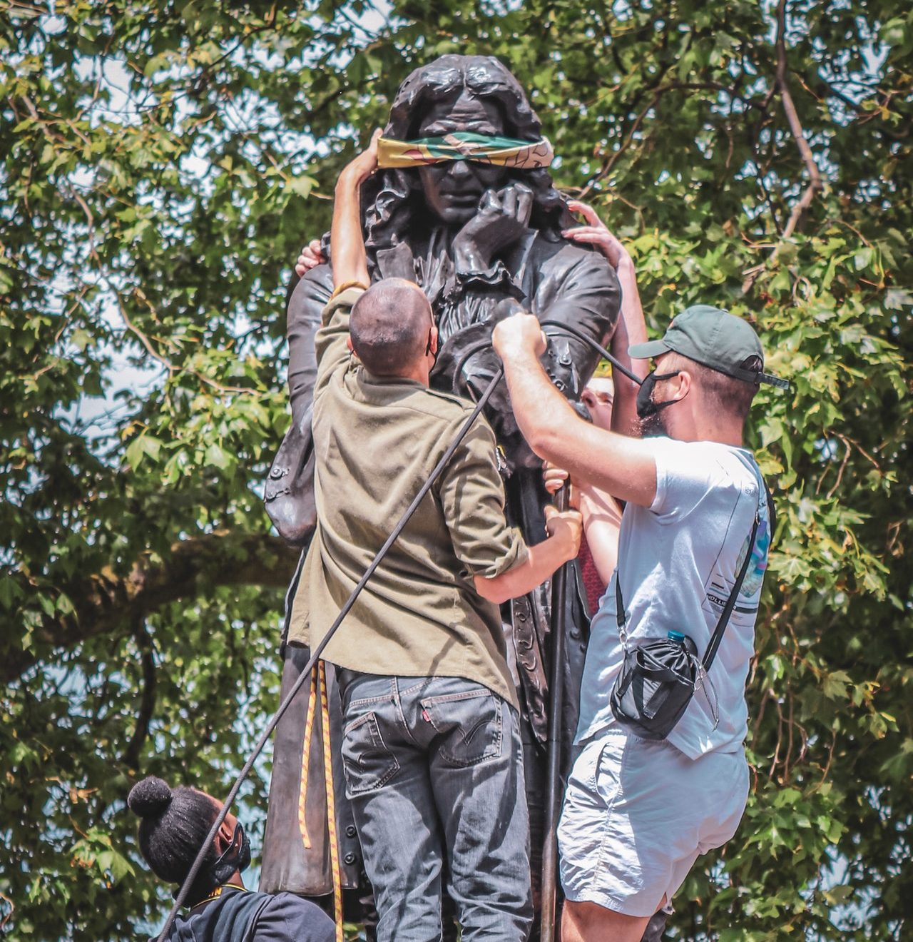 statue of Colston, blindfolded by activists